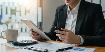 Person smiling while reviewing 2026 tax documents on a tablet, indicating successful tax planning.